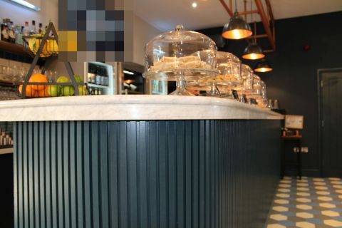 Café counter with cakes on display